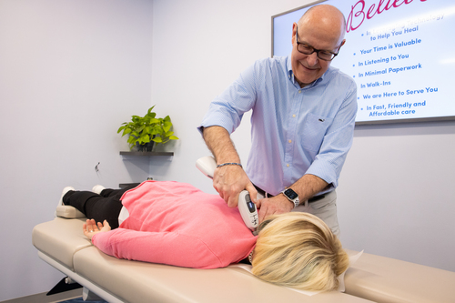 Chiropractor adjusting patients back |Best Chiropractor in Ann Arbor 