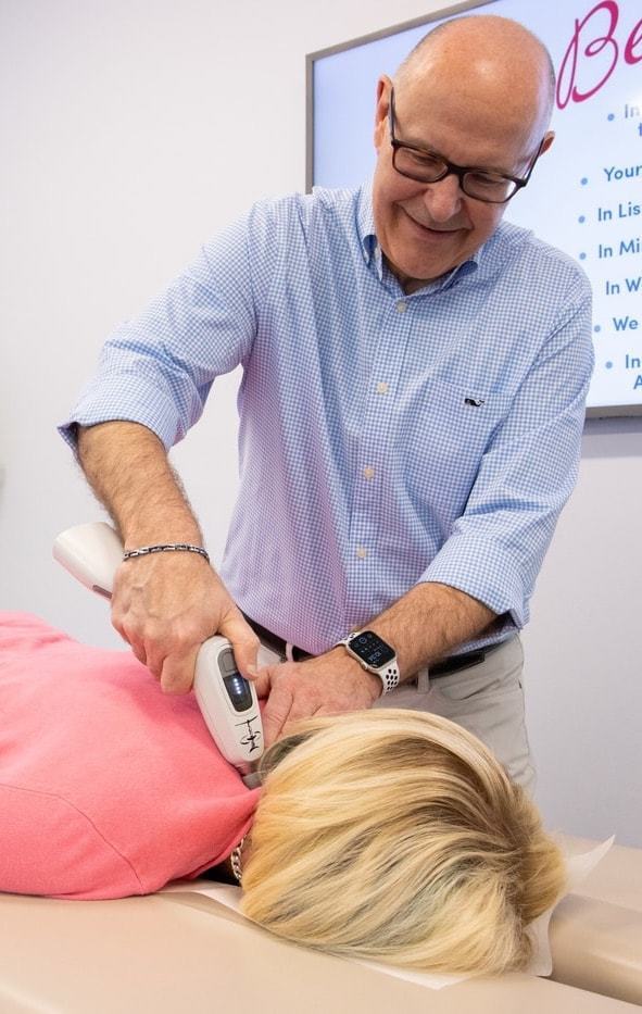 Dr. Bill demonstrating Activator method | Thatcher Chiropractic & Laser | Chiropractor near me